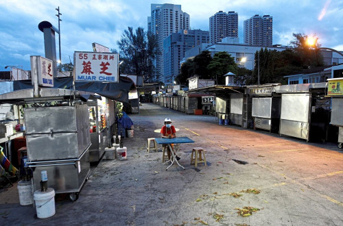A Rojak stall owner waiting for customer at Anjung Gurney Hawker Centers in Gurney Drive,Penang. Bus