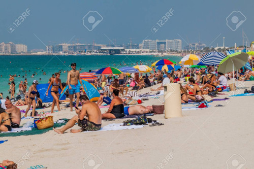 90981598 dubai uae october 21 2016 people at marina beach in dubai united arab emirates